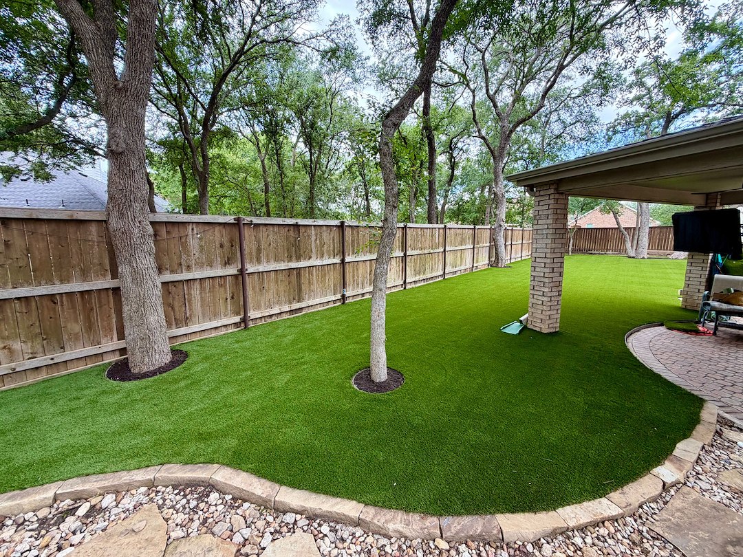 Backyard Turf Installation with Clean Tree Detailing in Flower Mound, TX